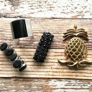 Multiple black bracelets